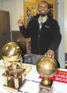 Photo by Paula Nicewanger/Weekly ViewHead Coach Barnes with the McDonald’s Holiday Classic Tournament trophy on left and the City Championship trophy on the right.