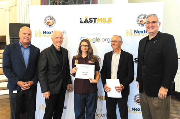 submitted photo
From left to right: Indiana Department of Correction Commissioner Rob Carter, The Last Mile Co-Founder Chris Redlitz, The Last Mile Graduate Jennifer Fleming, The Last Mile Director of Expansion Jack Cochran, and Gov. Holcomb.