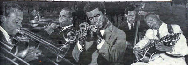 photo by Leslie K. HogueIndy-associated jazz artists David Young, Jimmy Coe, David Baker, JJ Johnson, Slide Hampton, Freddie Hubbard, Larry Ridley are the focus of this Arts Council funded mural at 322 N. Capitol by Pamela Bliss.